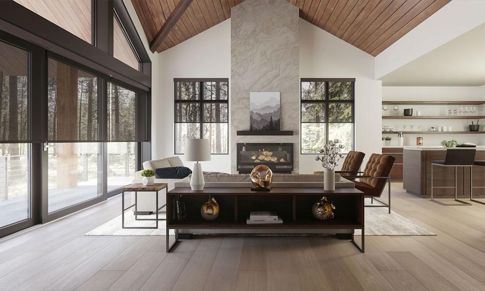 Elegant living room with vaulted ceiling, stone fireplace, and modern decor