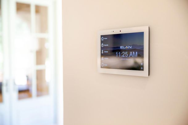 Elan Smart Home touch panel in a neutral colored wall in Montecito